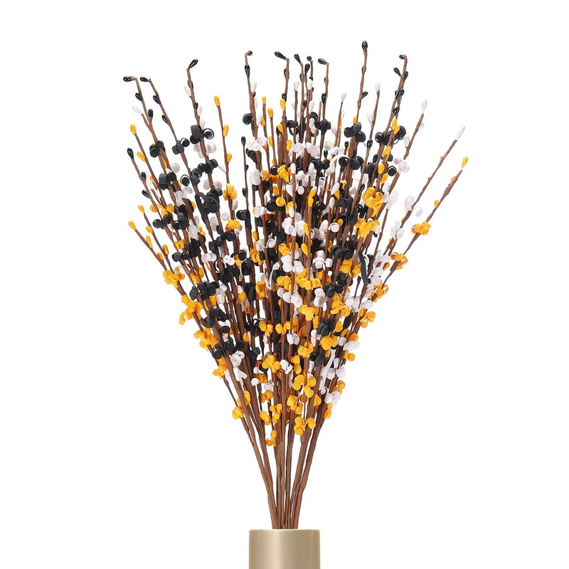 Tall artificial jasmine flower stems with black, white and gold buds in a bouquet
