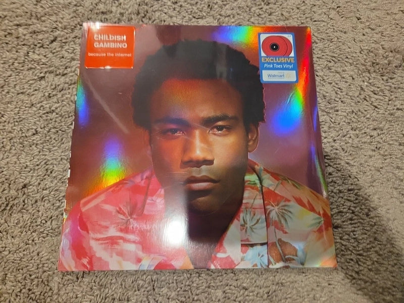 Pink vinyl record sleeve with portrait cover, rainbow holographic foil.