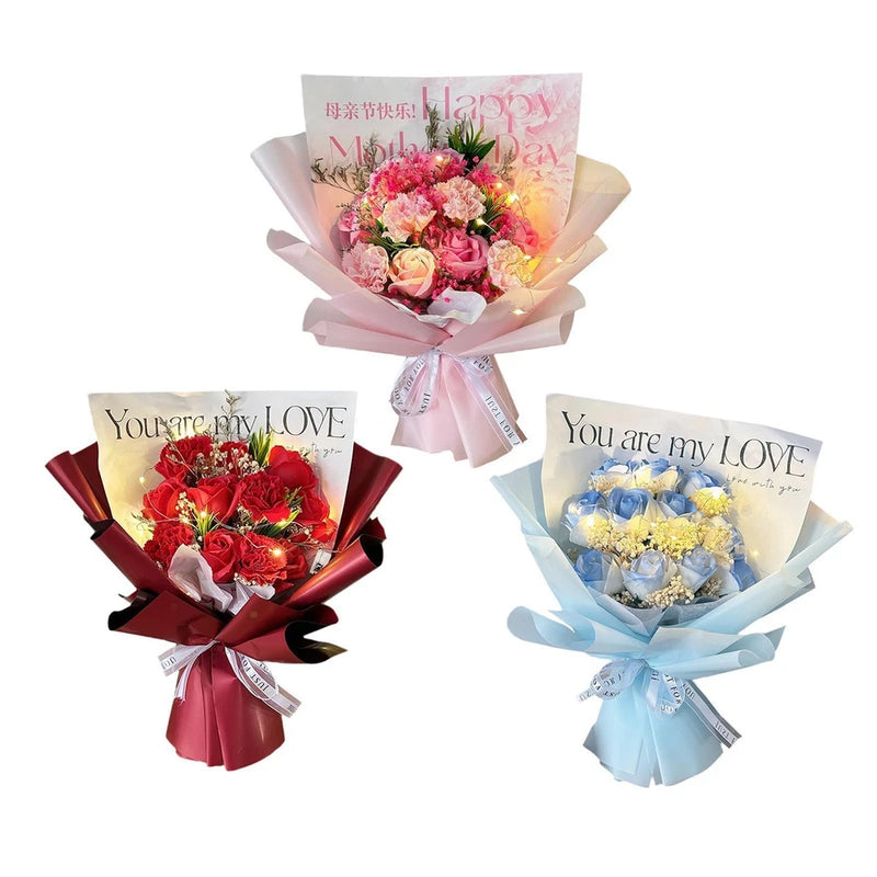 Set of three artificial soap flower bouquets in pink, red, and blue with ribbons.