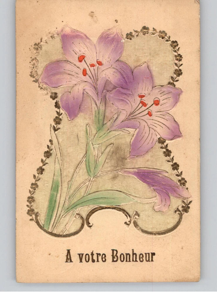 Vintage purple lily floral postcard with ornate vine border and script text
