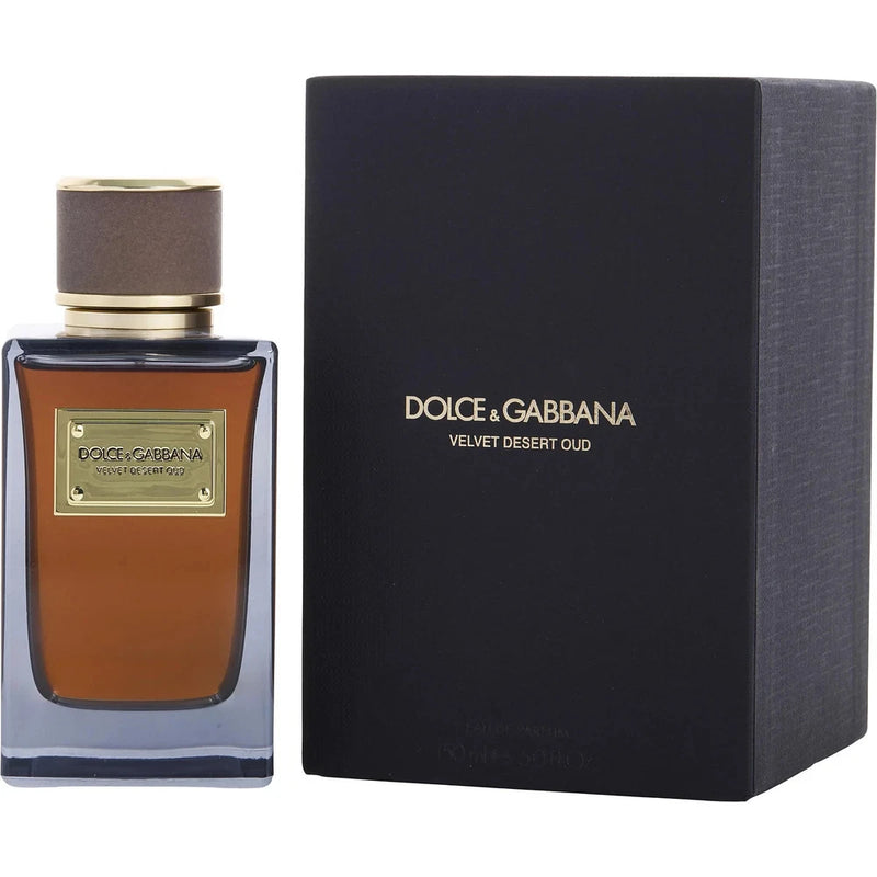 Amber eau de parfum bottle with gold cap and dark Dolce & Gabbana box