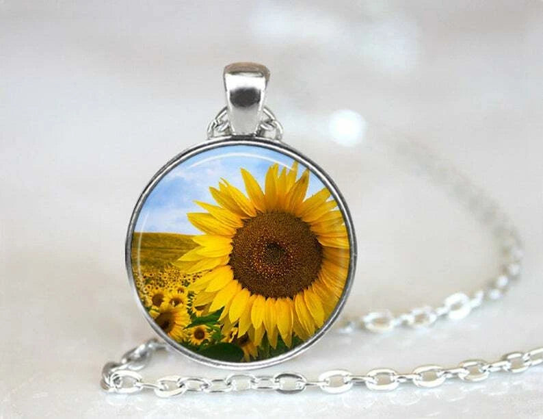 Sterling silver sunflower pendant necklace, round blue cabochon with yellow flower center