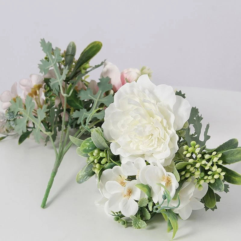 Artificial peony camellia flower arrangement with white blooms and green foliage