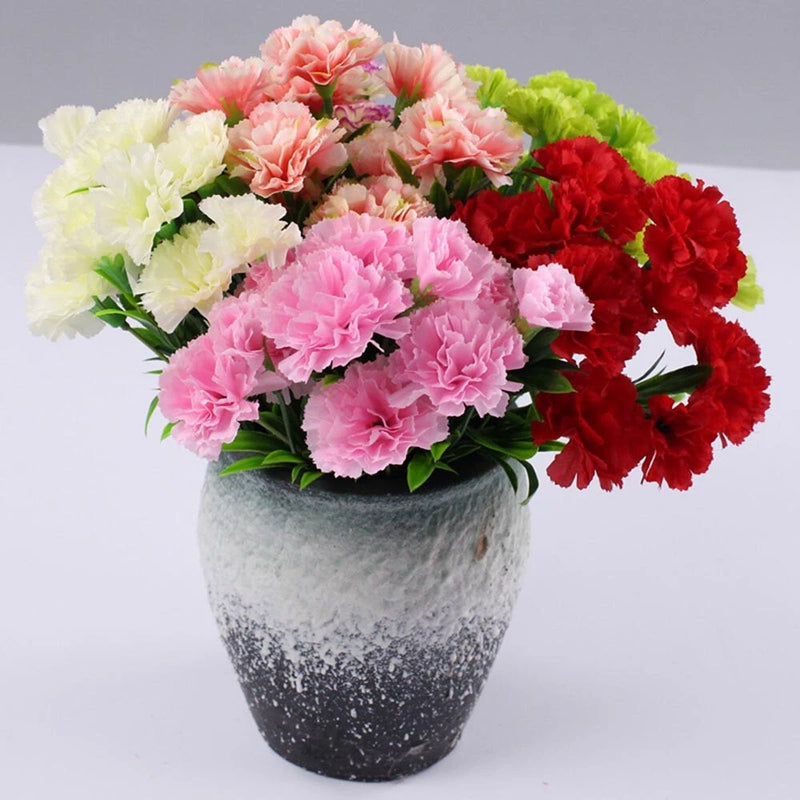 Faux carnation flower bouquet with pink, white, and red blooms in gray speckled pot