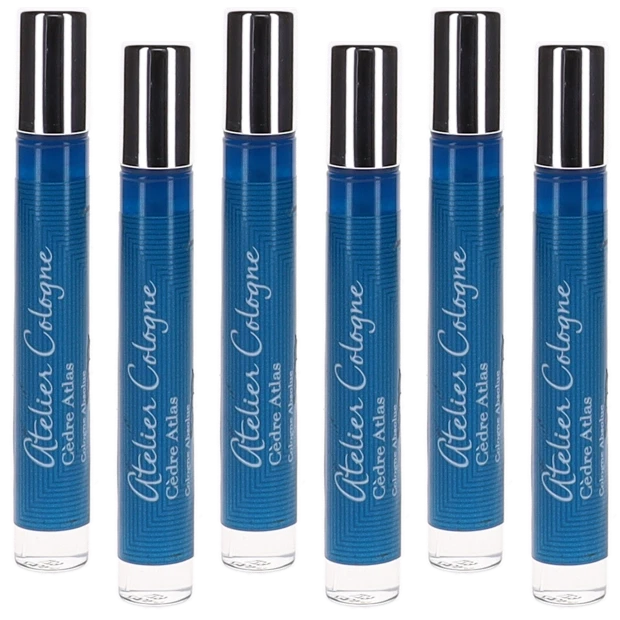 Set of six blue perfume bottles with silver caps and clear bases