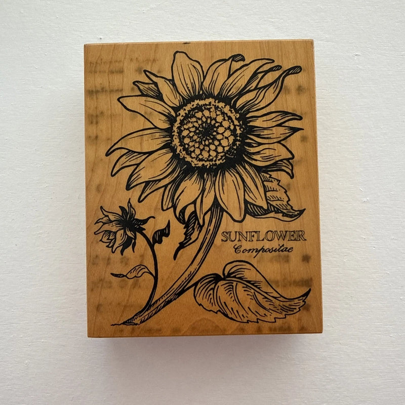 Sunflower rubber stamp on a wooden block, with bold sunflower and leaf design