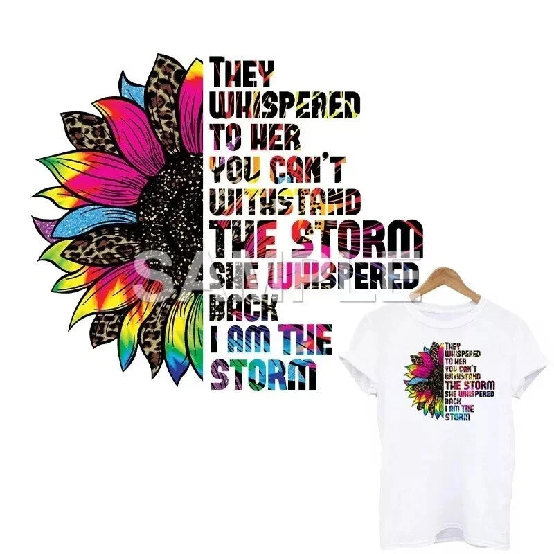 White short-sleeve T-shirt with colorful sunflower graphic and storm-themed text on chest.