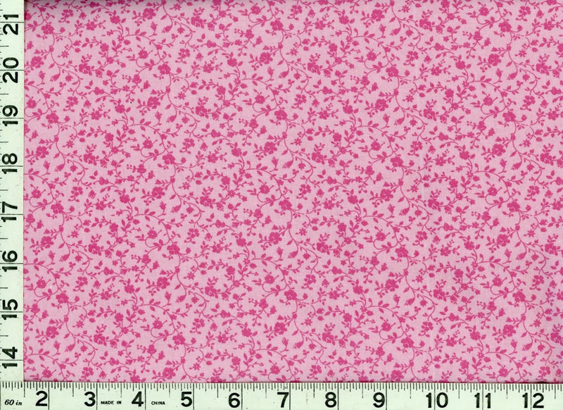 Light pink quilting fabric with dark hot pink roses and leafy vine pattern, yardage view