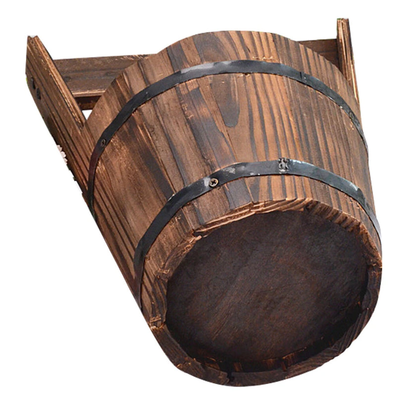 Wooden barrel-style plant pot with black metal bands and open top