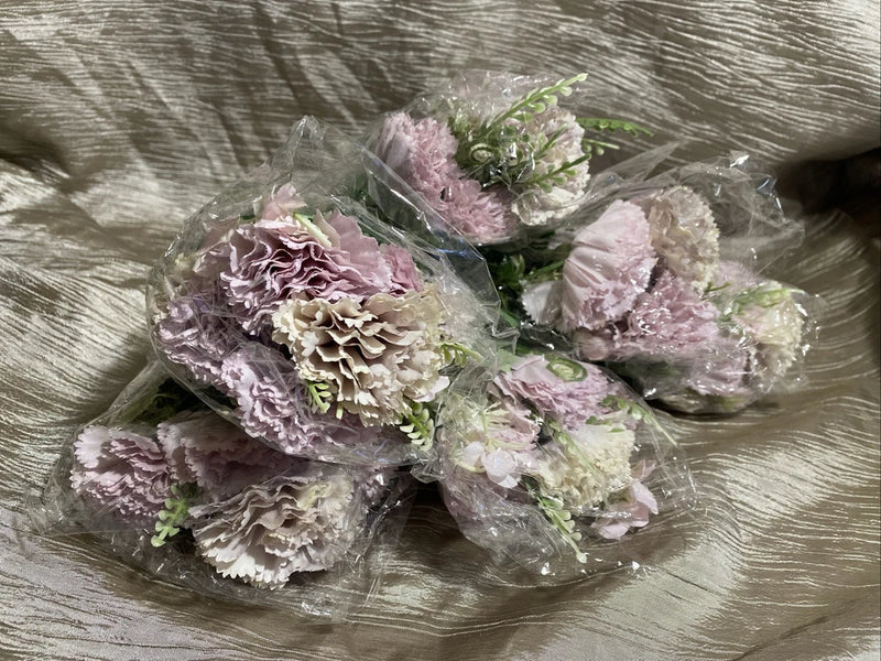 Artificial carnation flower bouquet with 6 pastel pink blooms and green leaves