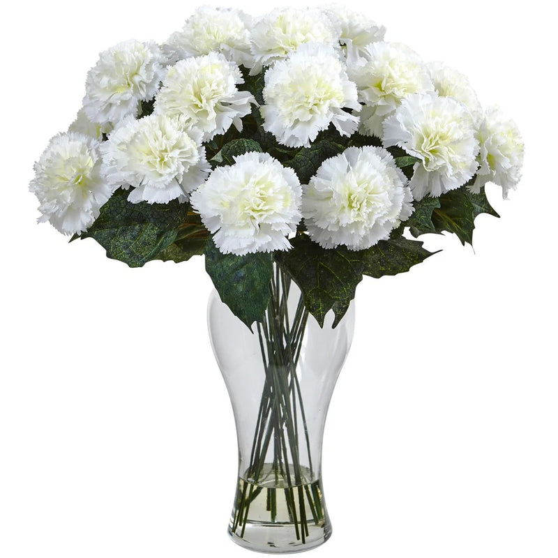 Cream artificial carnation flower arrangement in clear glass vase