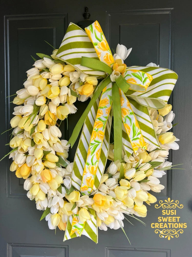 Spring tulip-style wreath with yellow and white blossoms and green striped ribbon bow