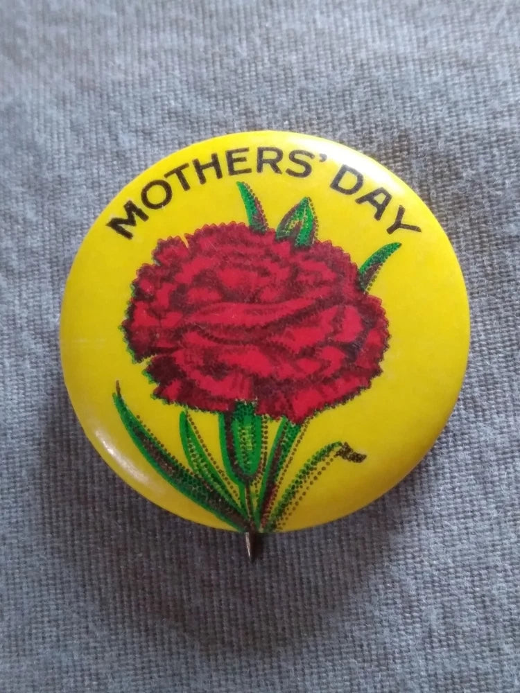Mothers' Day pinback button with red carnation flower on yellow background