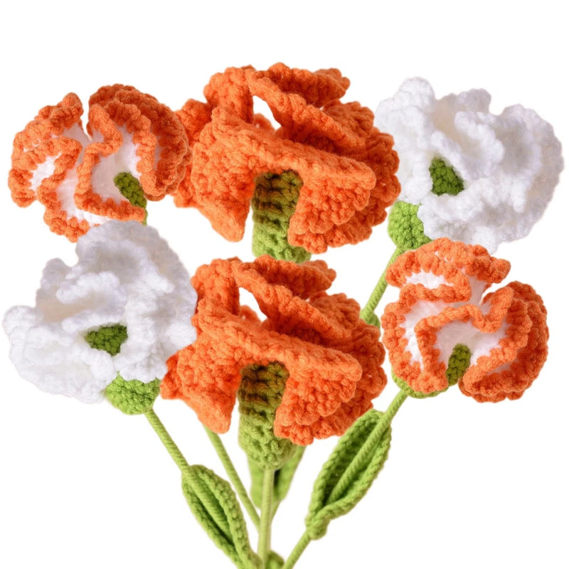 Crochet flower bouquet of orange carnation-style blooms with green stems and leaves