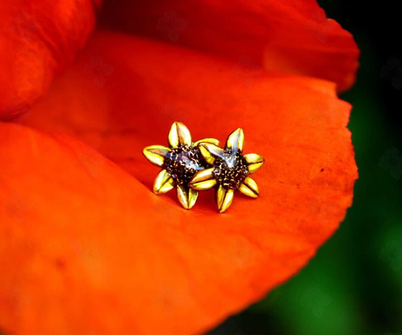 Sunflower stud earrings with gold-toned petals and dark center on small round posts
