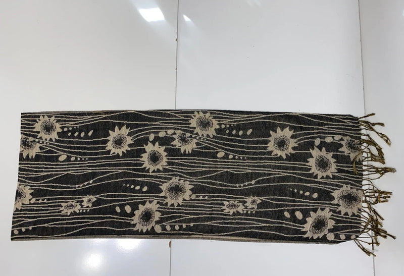 Sunflower scarf with dark base, scattered sunflower motifs, fringe ends