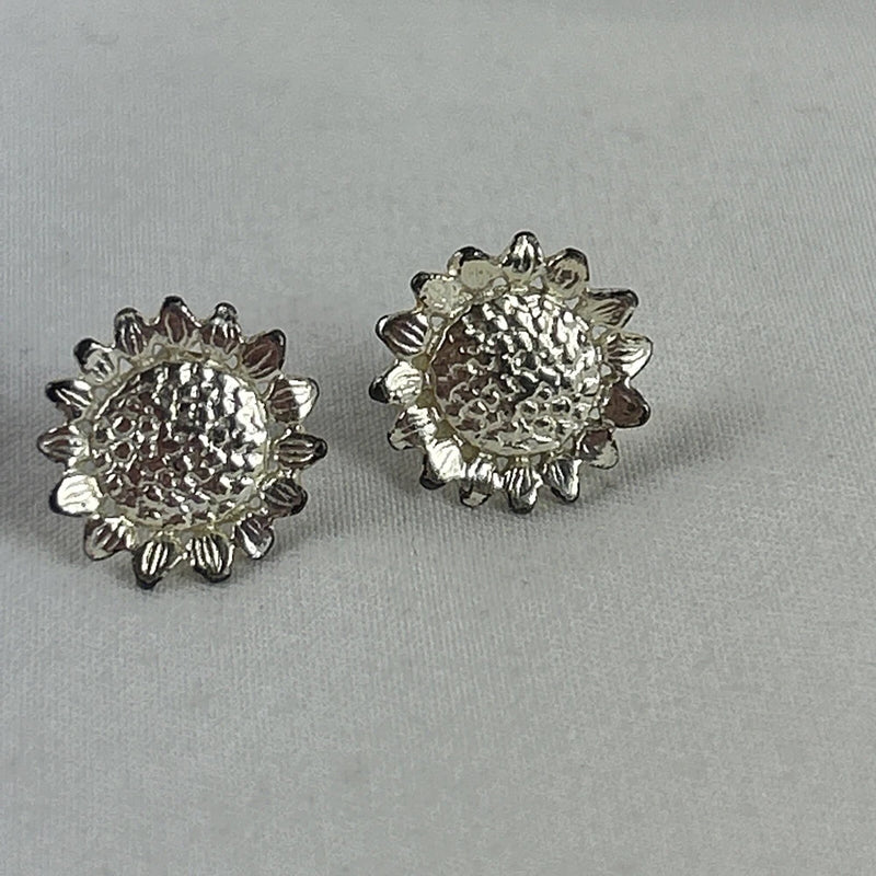 Textured silver-tone sunflower stud earrings with round textured centers and post backs