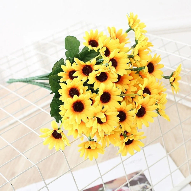 Silk sunflower bouquet with bright yellow blooms, dark centers, and green leaves