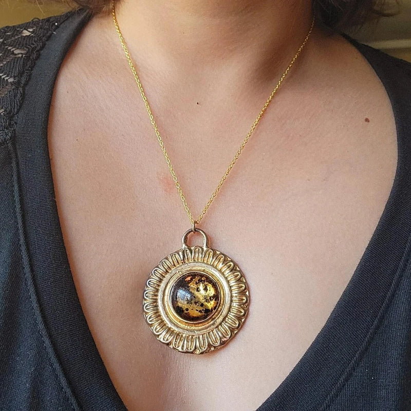 Gold-tone sunflower gemstone pendant necklace with brown center, thin chain