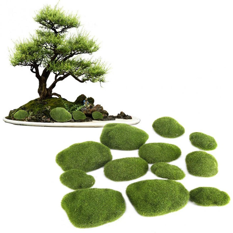 Artificial moss stones set with green oval pieces and small bonsai on tray