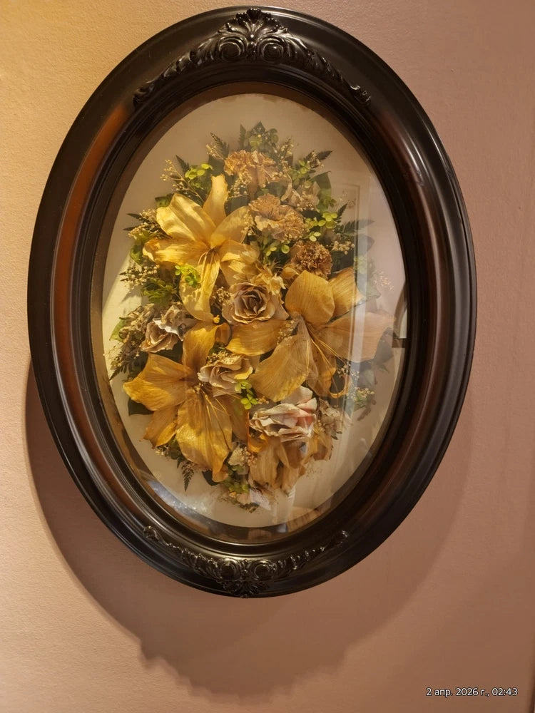 Oval framed convex glass art with dried yellow lily flowers bouquet