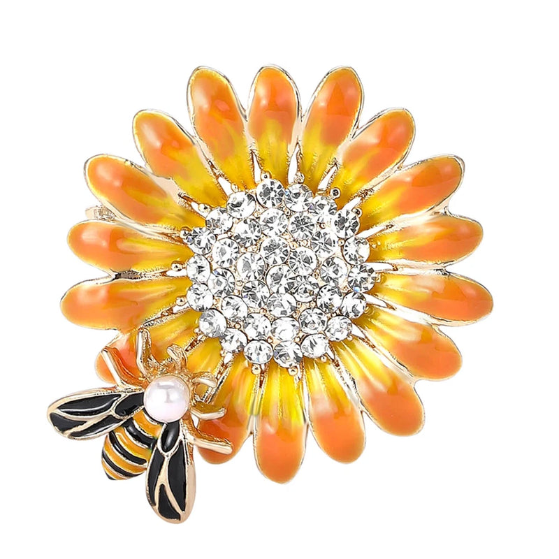 Gold-tone sunflower and bee rhinestone brooch pin with orange petals and pearl detail