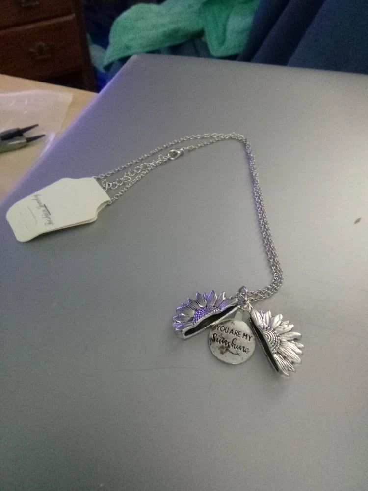 Sunflower necklace with silver chain and heart charm with purple flower and small crystal accents