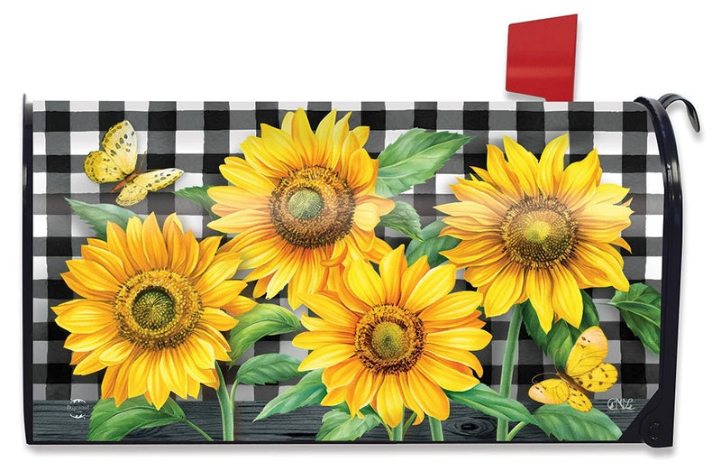 Large oversized mailbox cover with black-and-white check pattern and bright yellow sunflowers.