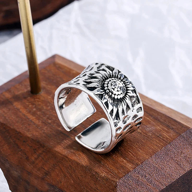 Sunflower engraved statement ring with distressed silver-tone finish, wide band