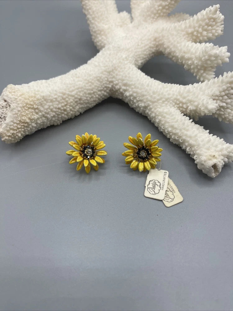 Yellow sunflower clip-on earrings with dark jeweled centers, gold-tone petals.