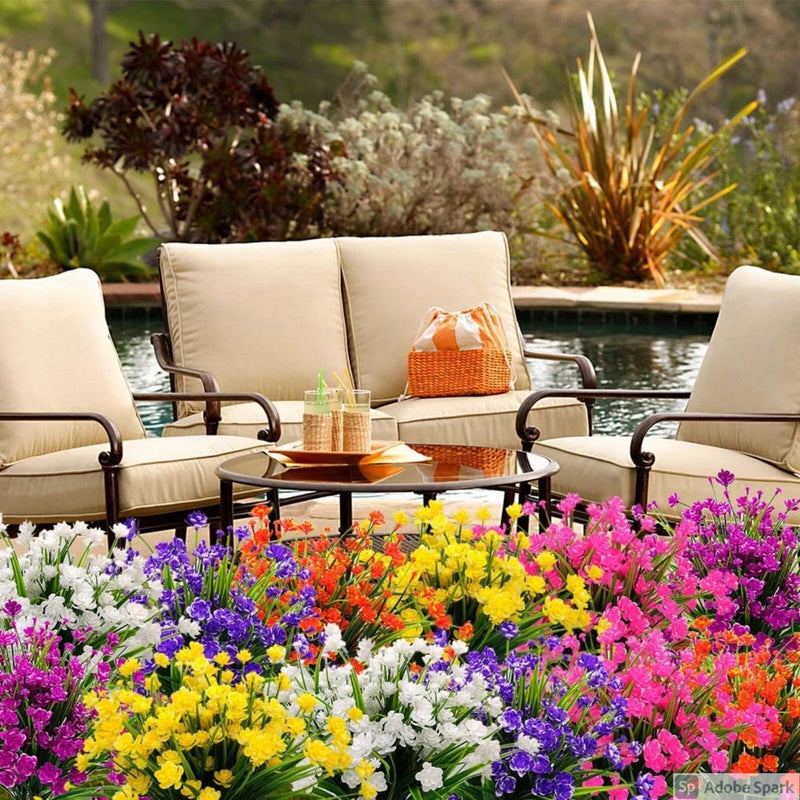 Outdoor artificial flower bouquet with dense multi-color blooms and green foliage