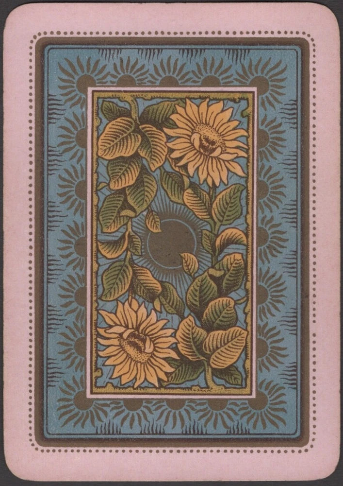 Antique-style playing card back with teal frame and golden sunflower artwork