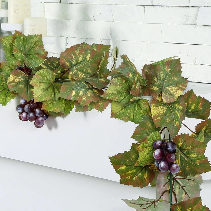Artificial grape leaf garland with green and burgundy leaves, plus dark purple grapes