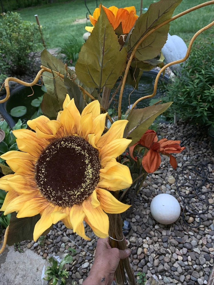 Long-stem sunflower floral arrangement with large yellow bloom and dark center