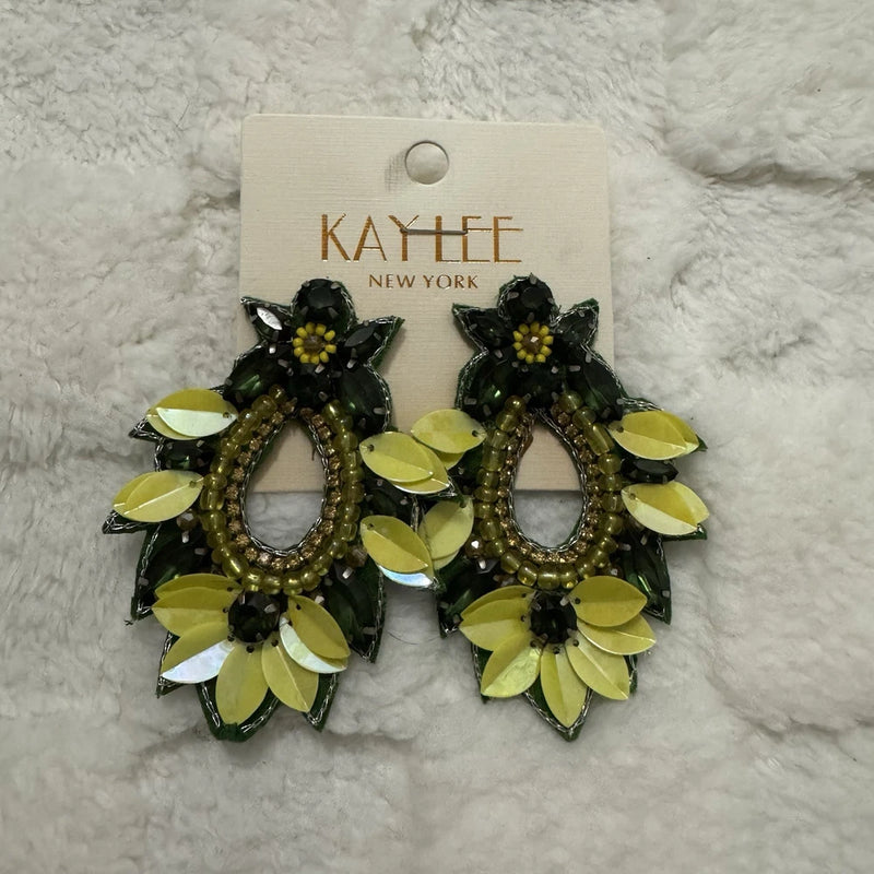 Sunflower beaded statement earrings with green and yellow petal accents