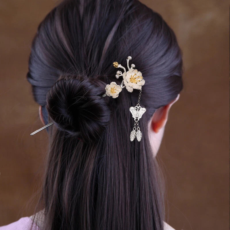 Silver-tone pearl peony flower hairpin with dangling charm, pinned on dark hair