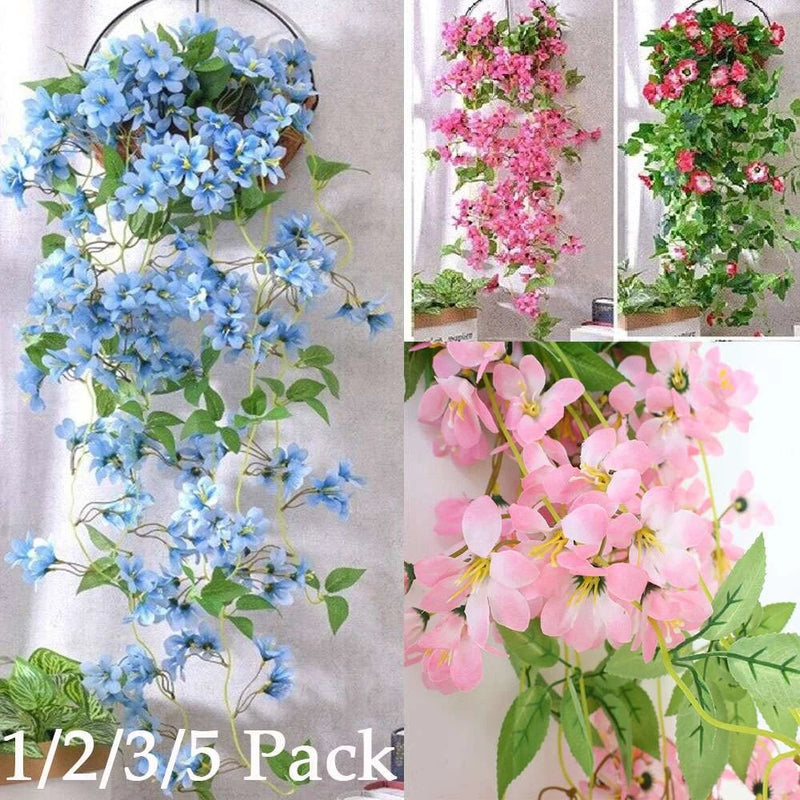Artificial blue flower ivy vine garland with clustered blossoms and green leaves