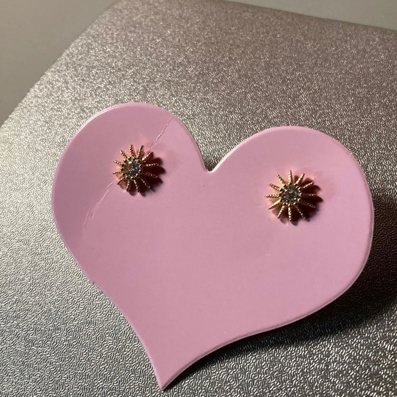 Gold tone sunflower stud earrings with two small flower-shaped studs