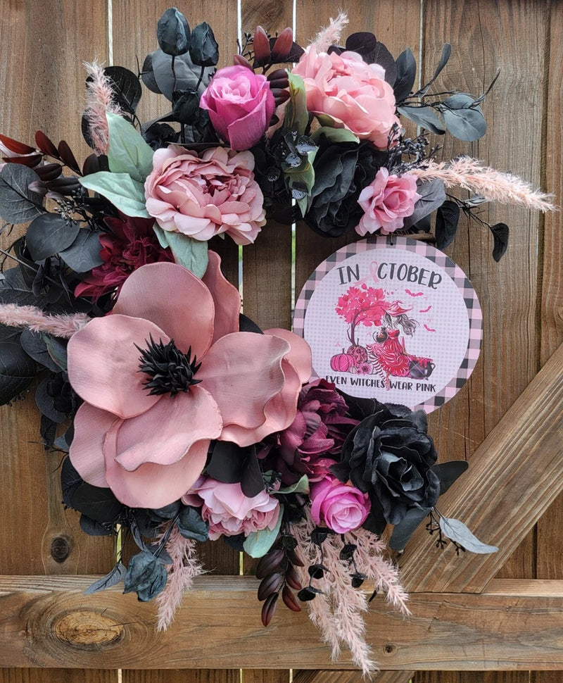 Pink and black floral grapevine wreath with large light-pink fabric flower and center sign