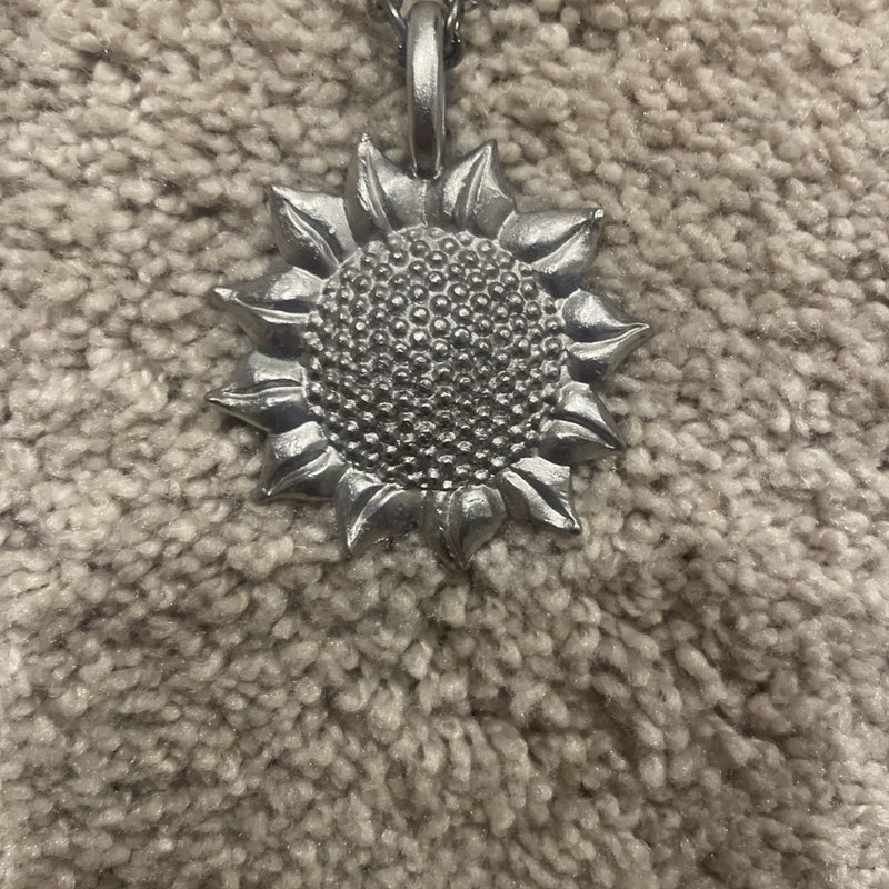 Silver sunflower pendant necklace, round textured center with spiky petals