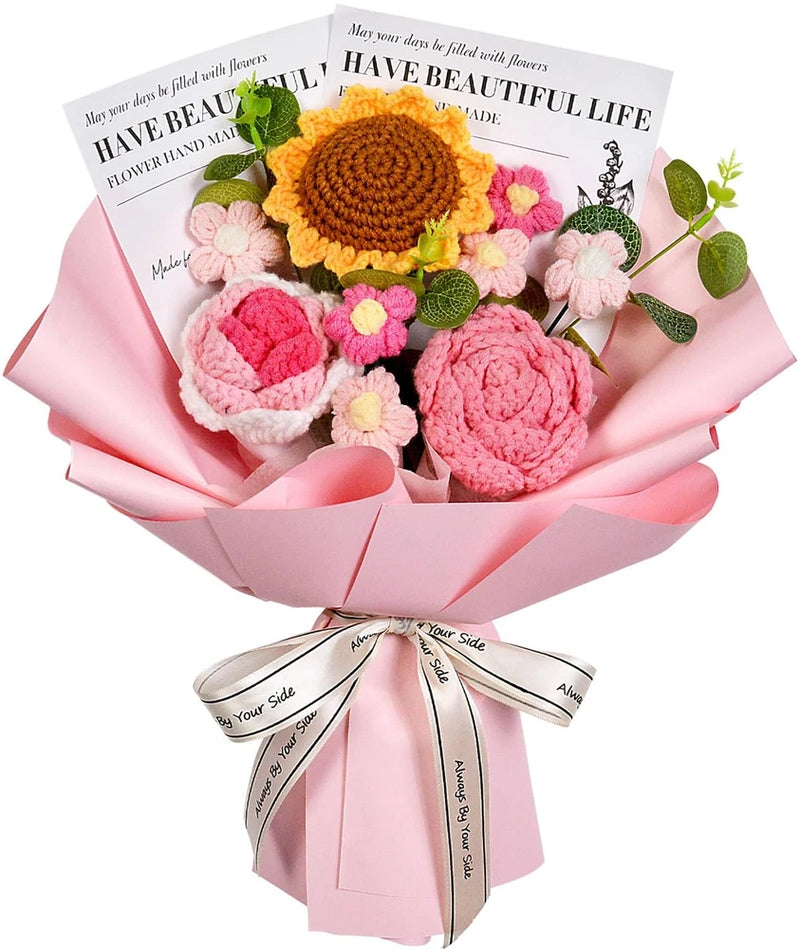 Pink and orange crochet flower bouquet with large sunflower centerpiece and tied ribbon