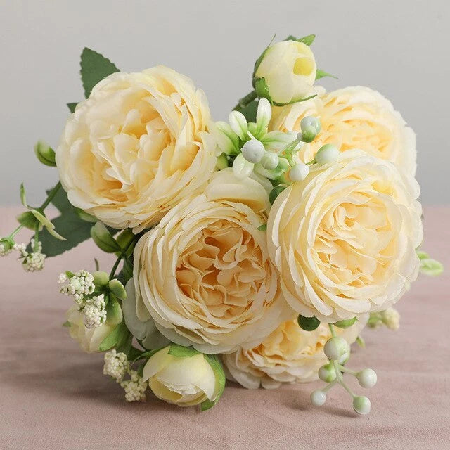 Artificial silk peony bouquet with cream flowers, green leaves, and white berry stems