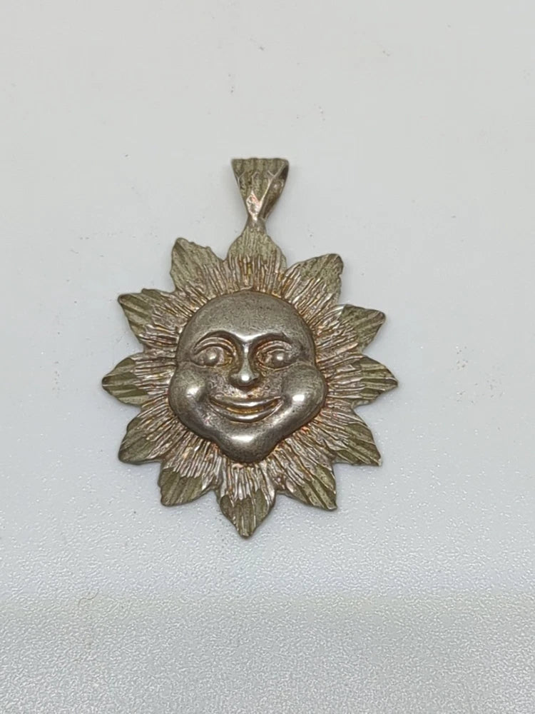 Smiling sunflower sun pendant in silver-tone metal