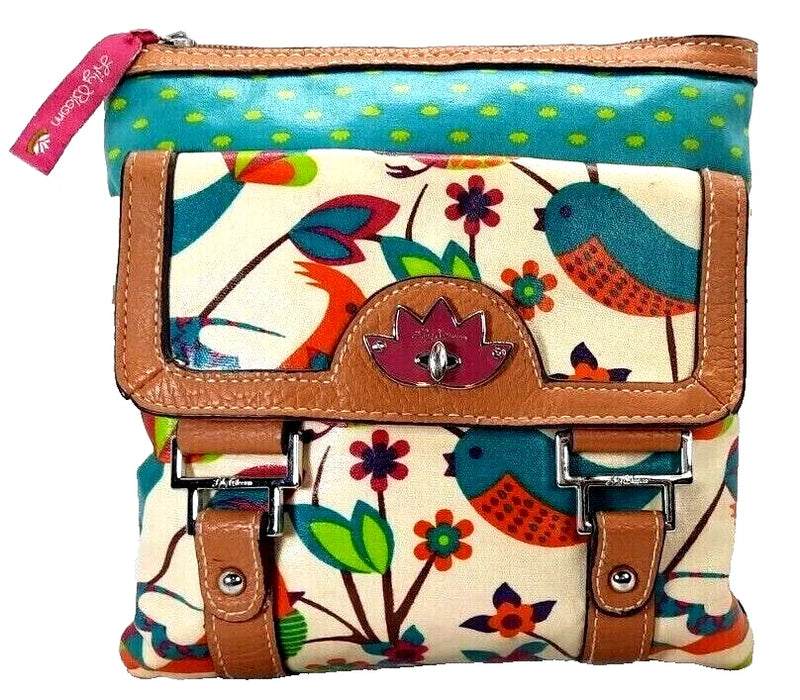 Colorful floral and bird zip pouch with brown leather trim and front patch clasp