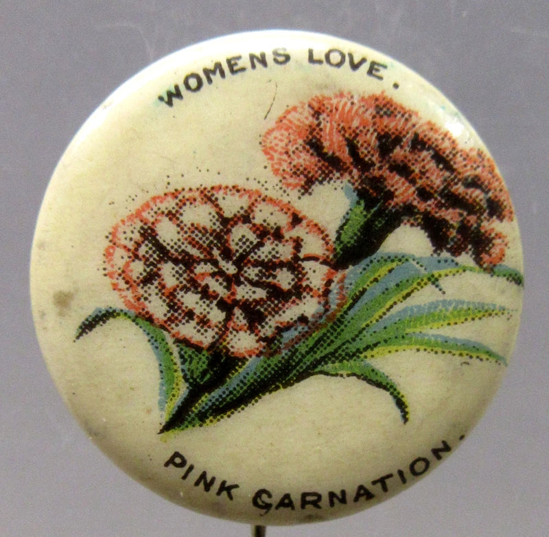 Pink carnation pinback button with printed flowers and text "WOMENS LOVE"