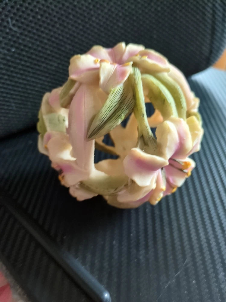 Pink and cream lily flower orb with curled petals, small bud details