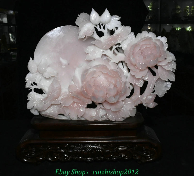 Pink and white jade carving statue with peony flowers and perched birds on dark base