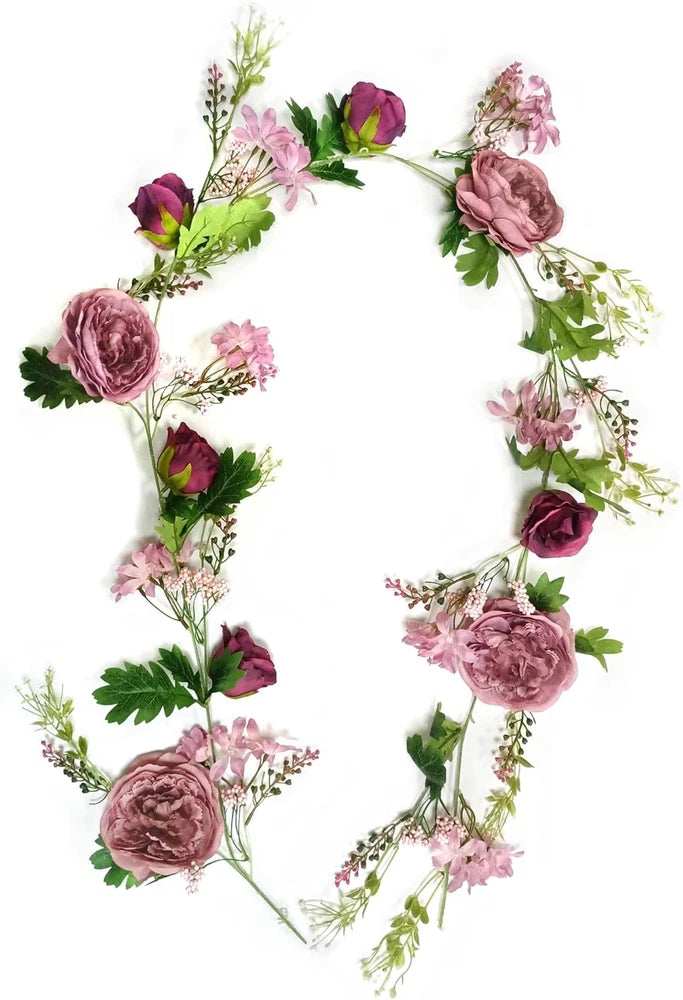 Pink peony and rose flower garland swag with green leaves and trailing stems