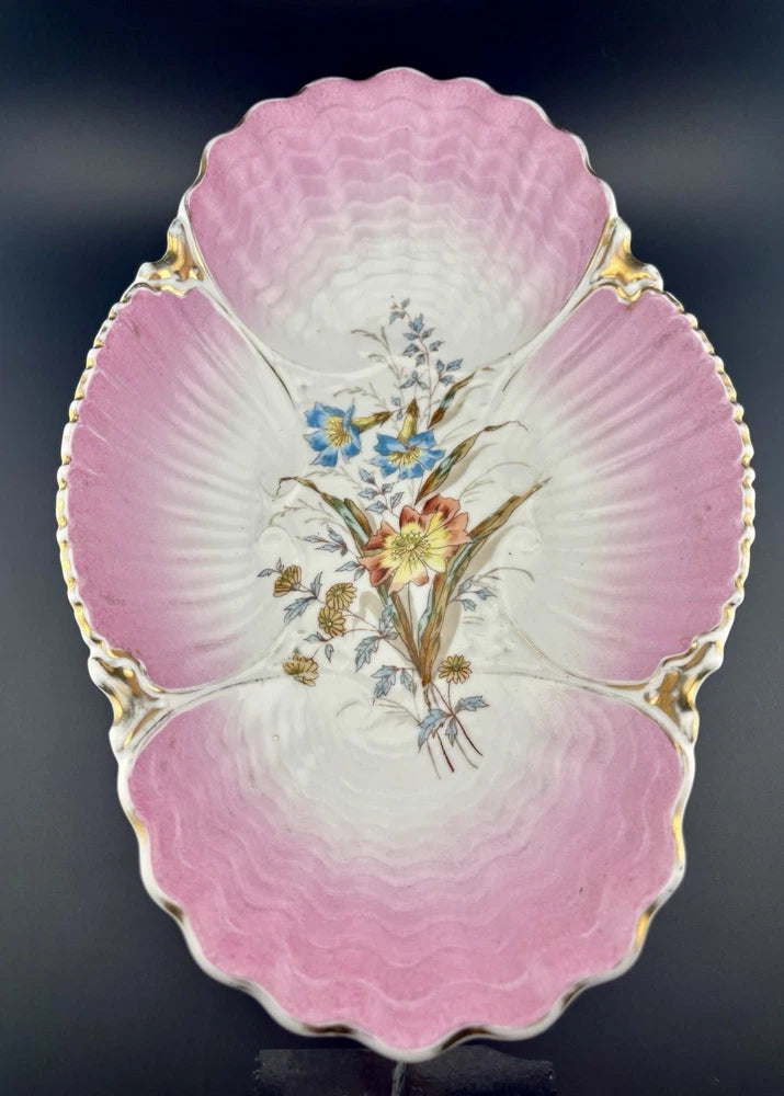 Pink porcelain clam-shell dish with floral bouquet and gold trim