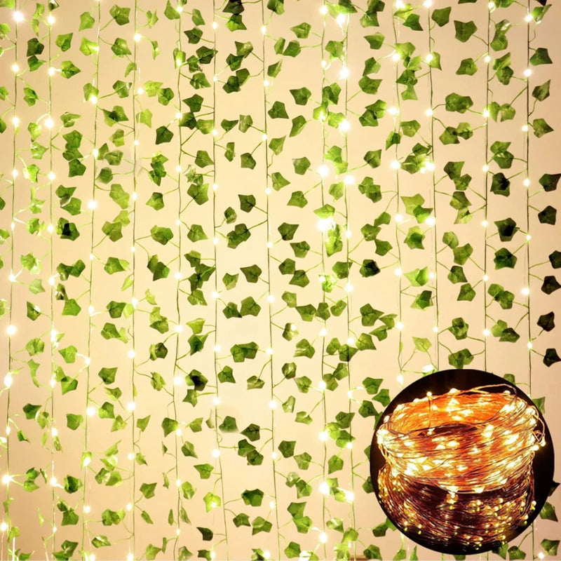 Artificial ivy vine garland with warm LED string lights and green leaf clusters